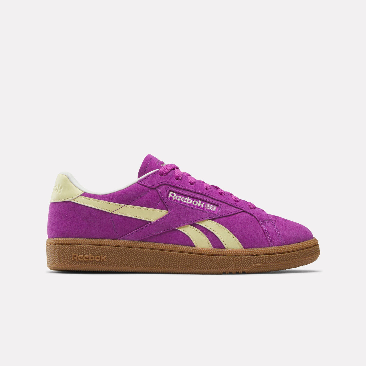 Low-cut magenta sneaker with gum sole and beige side stripe.