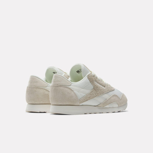 Low profile sneakers in off white and beige.
