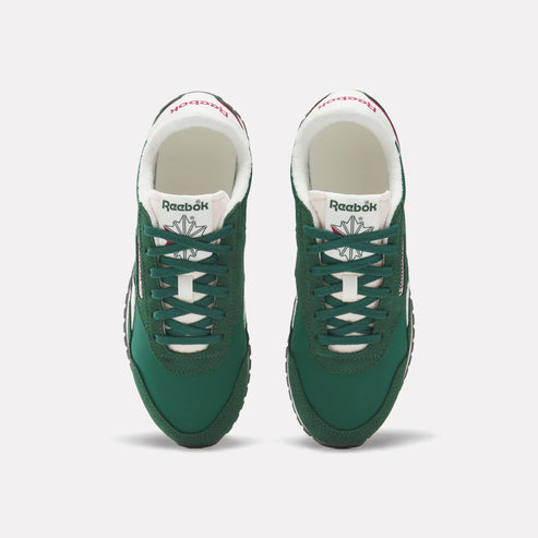 A pair of green Reebok running shoes with white laces, seen from above.