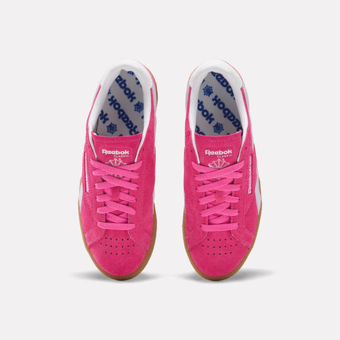 A pair of pink Reebok Classic Club MEMT sneakers with white laces and gum soles.
