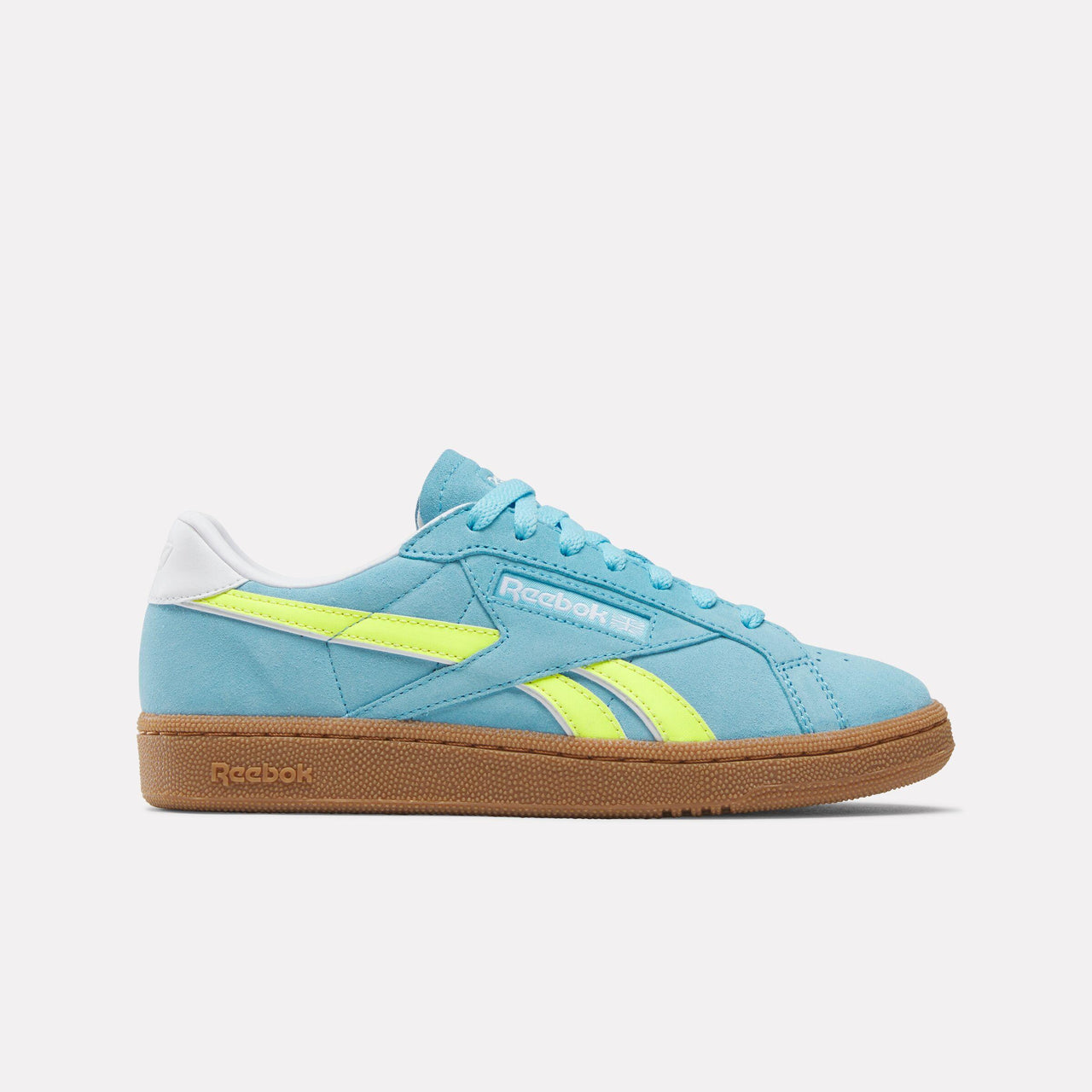 A light blue sneaker with a light brown sole and yellow stripe.