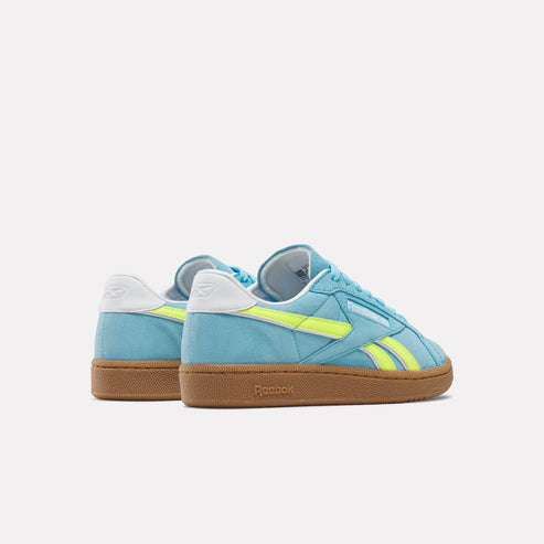Aqua shoes with yellow accents and brown sole.