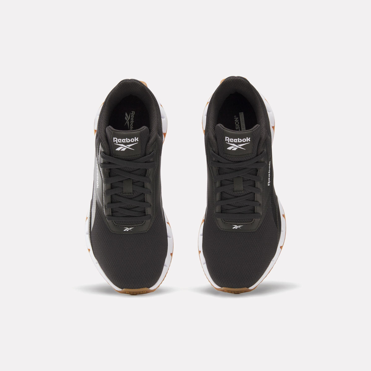 A pair of black athletic shoes with visible Reebok logo.