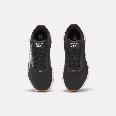 A pair of black athletic shoes with visible Reebok logo.