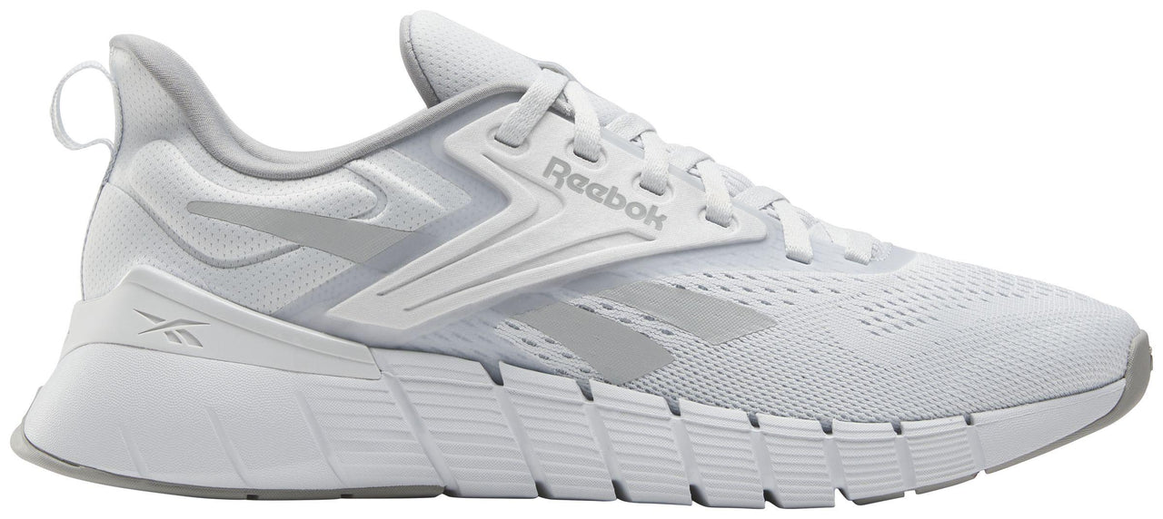 A white athletic shoe with the Reebok logo on the side.