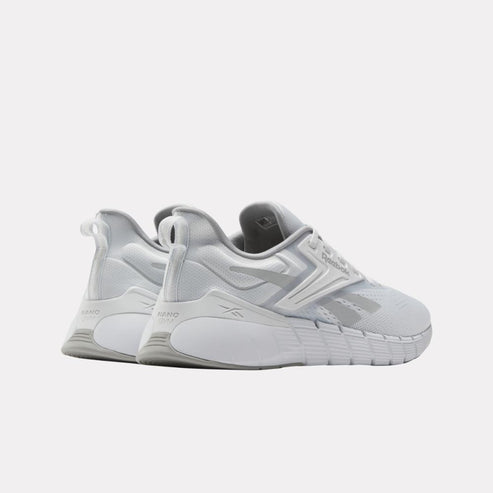 Low profile white athletic shoes with synthetic upper, zig-zag textured sole, and pull tab.