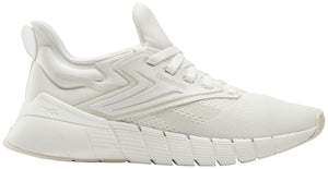 A white sneaker with a zig-zag design on the side.