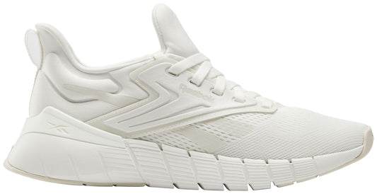 A white sneaker with a zig-zag design on the side.