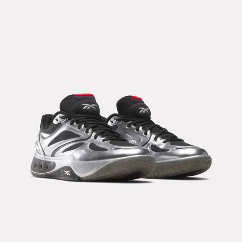 Two silver and black sneakers with black laces.