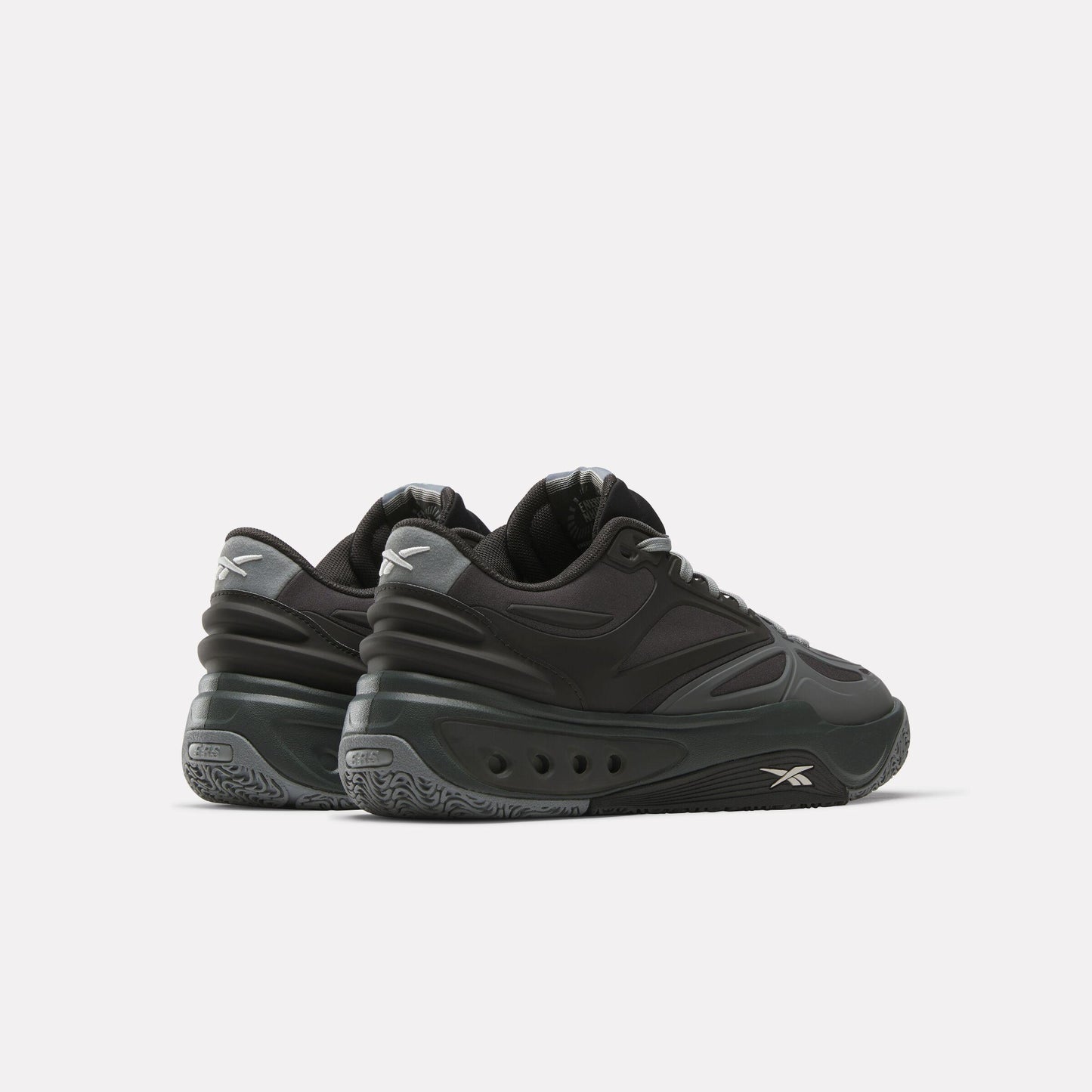 Low-top black athletic shoe with gray accents.