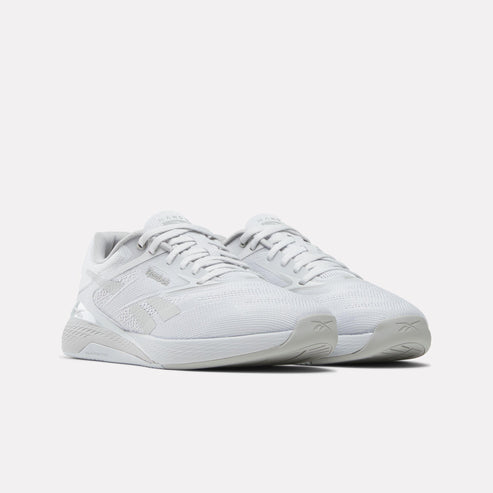 Two light gray athletic shoes with laces.