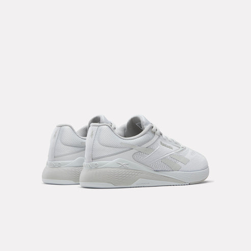 Pair of all-white training shoes.