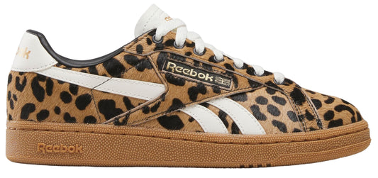 A pair of low-profile sneakers with leopard-print uppers, white stripes, and brown soles. The word "Reebok" appears on the side.