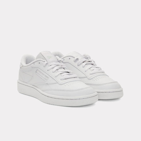 Pair of white leather sneakers with white laces.