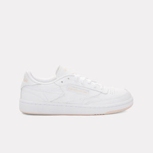 White low-top sneaker with a perforated toe, lace closure, and flat sole.