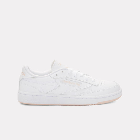 White low-top sneaker with a perforated toe, lace closure, and flat sole.