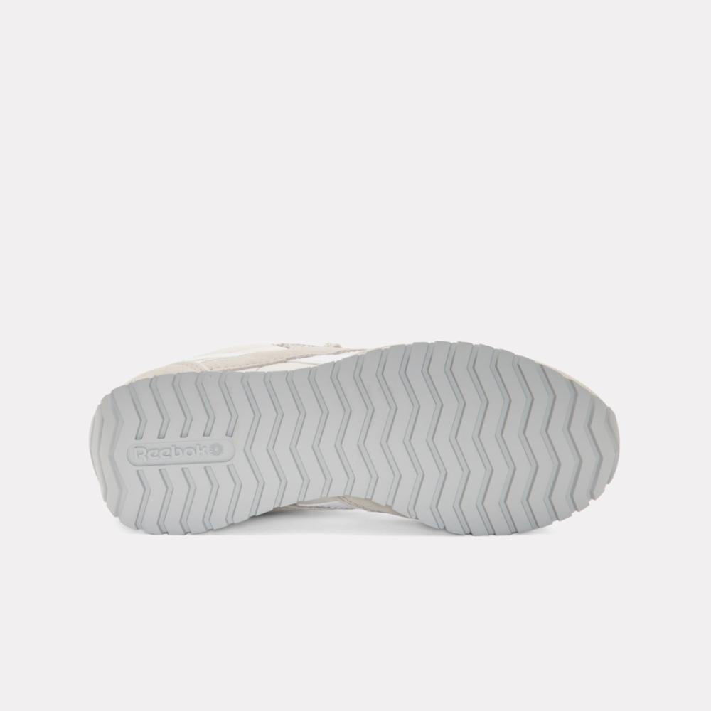 Gray rubber sole with a herringbone pattern and a visible "Reebok" logo.