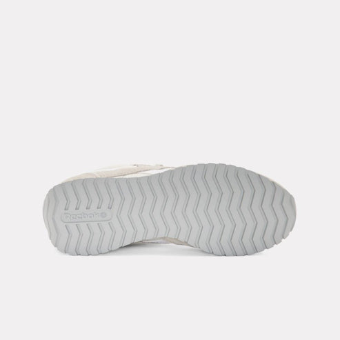 Gray rubber sole with a herringbone pattern and a visible "Reebok" logo.