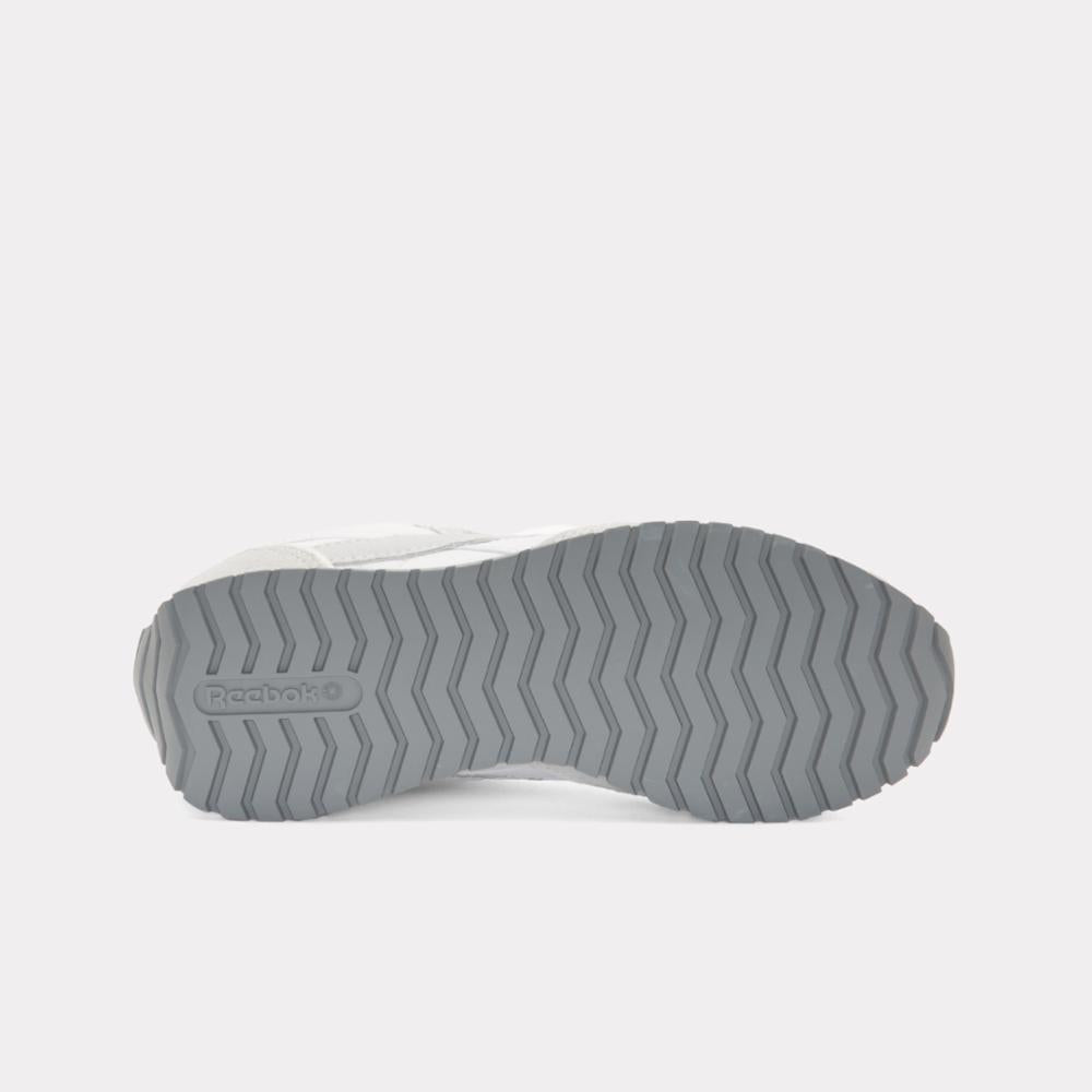 The outsole of a shoe with a waffle pattern. A logo is visible.