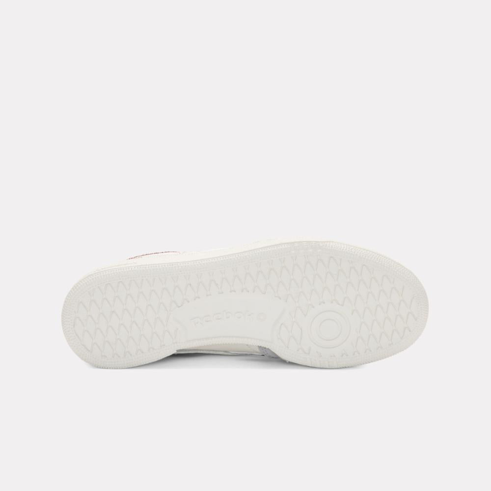 White sneaker sole with a geometric tread pattern.
