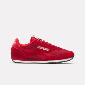 Red sneaker with white midsole and black outsole, 'Reebok' text on the side.