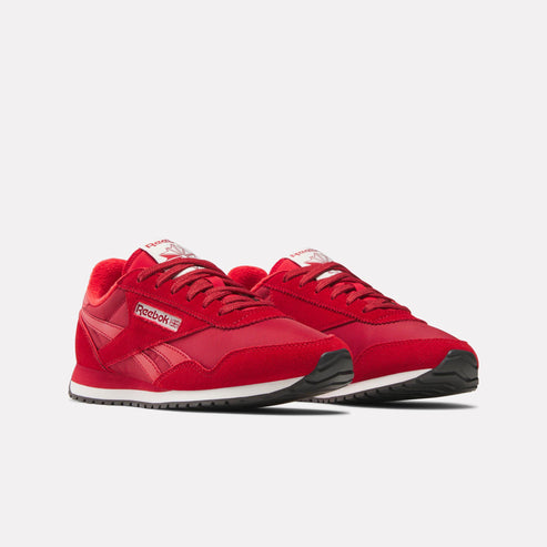 Pair of red sneakers with white soles and laces, and Reebok logo.