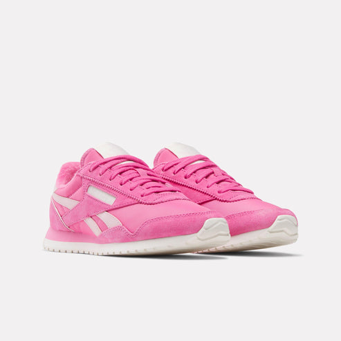 Pair of bright pink sneakers with white soles.