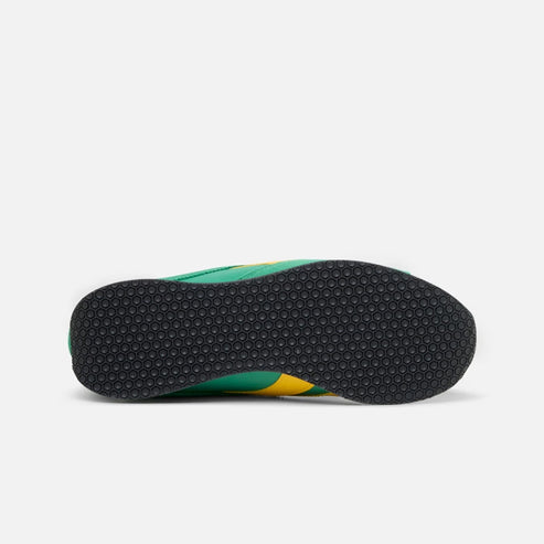 Green and yellow sneaker's black outsole.