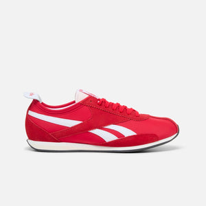 Red running shoe with white stripes and a black sole.