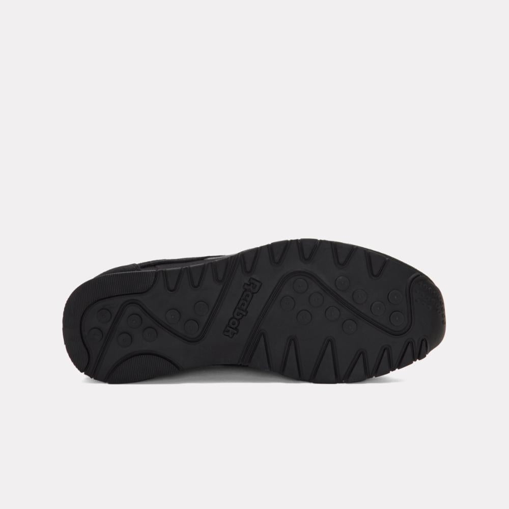 Black sneaker sole with brand name and triangular tread pattern.