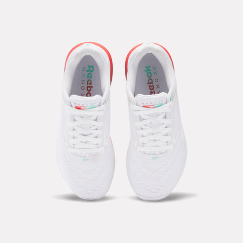 A pair of white sneakers with red accents and white laces.