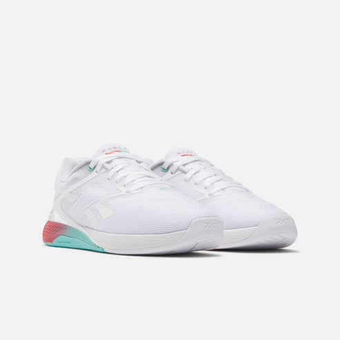 Pair of white sneakers with white laces, red/aqua sole accent, and HANOI text above the laces.