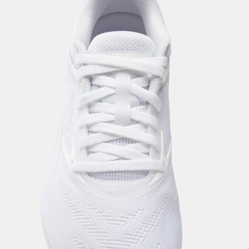 White athletic shoe with laced closure.