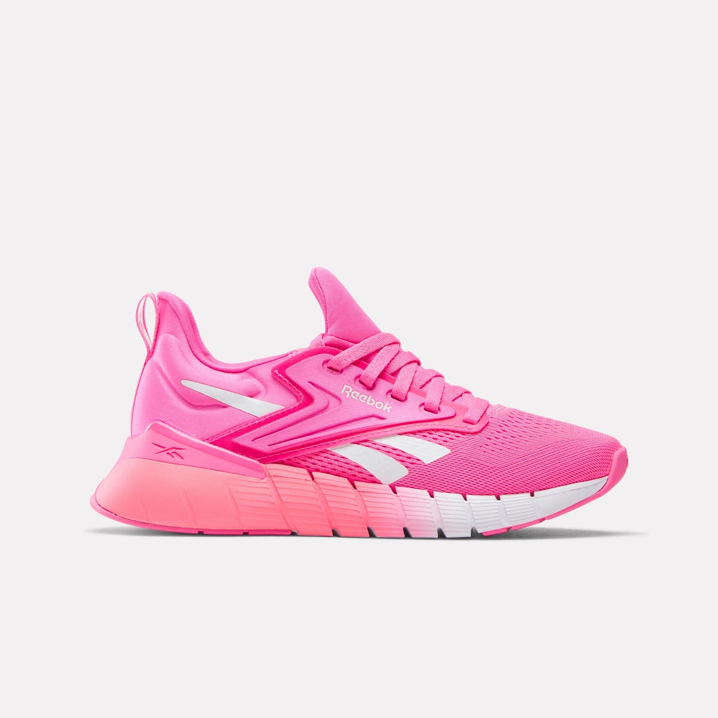 A pink sneaker with white accents.
