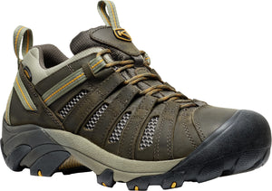 Brown leather hiking shoe with ventilation mesh, lace-up closure, and thick rubber sole.