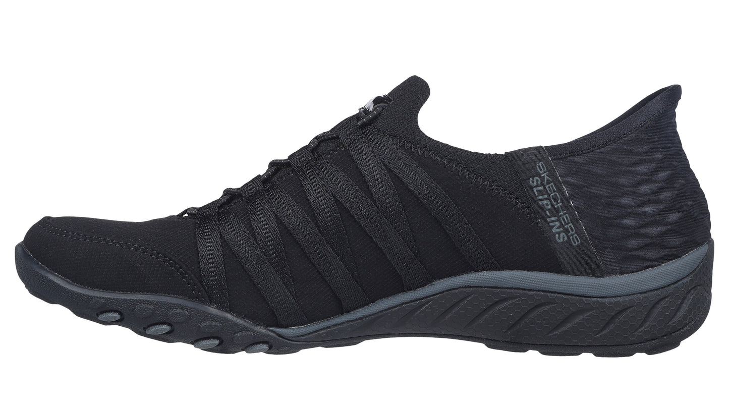 Slip-on sneaker in black with elastic bands across the top.