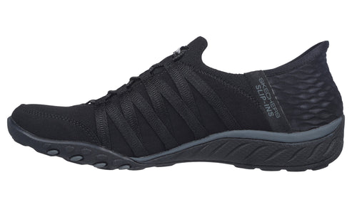 Slip-on sneaker in black with elastic bands across the top.