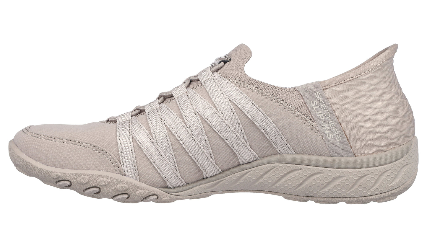 Beige slip-on sneaker with elastic straps and textured heel.