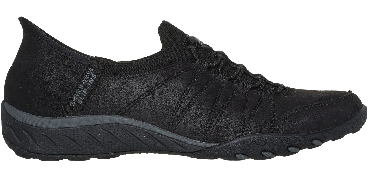 Black slip-on sneaker with a black sole.