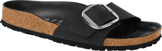 A black slide sandal with a large silver buckle on the strap, and a cork footbed.