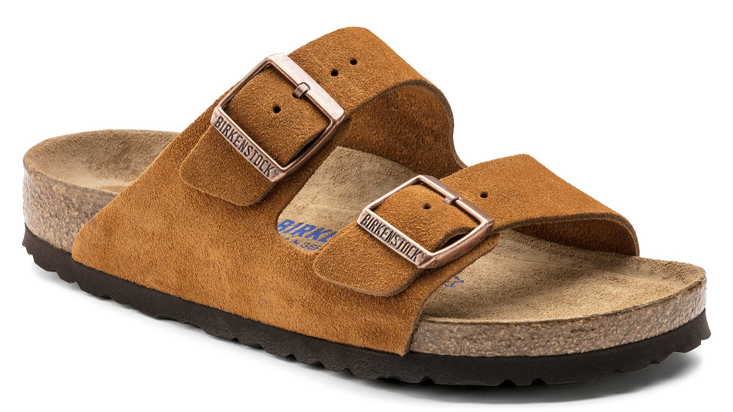Suede sandal with adjustable straps and metal buckles.