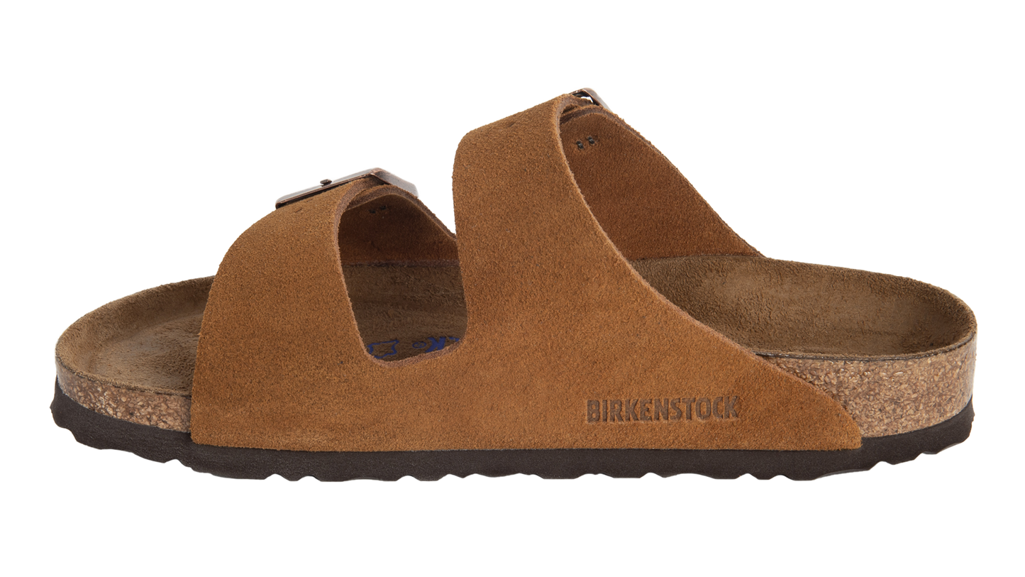 Brown suede sandal with asymmetrical strap and "BIRKENSTOCK" logo.