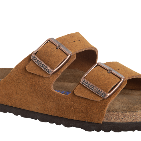 Suede sandals with two straps and metal buckles.