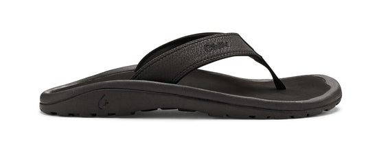 Black flip-flop with strap.