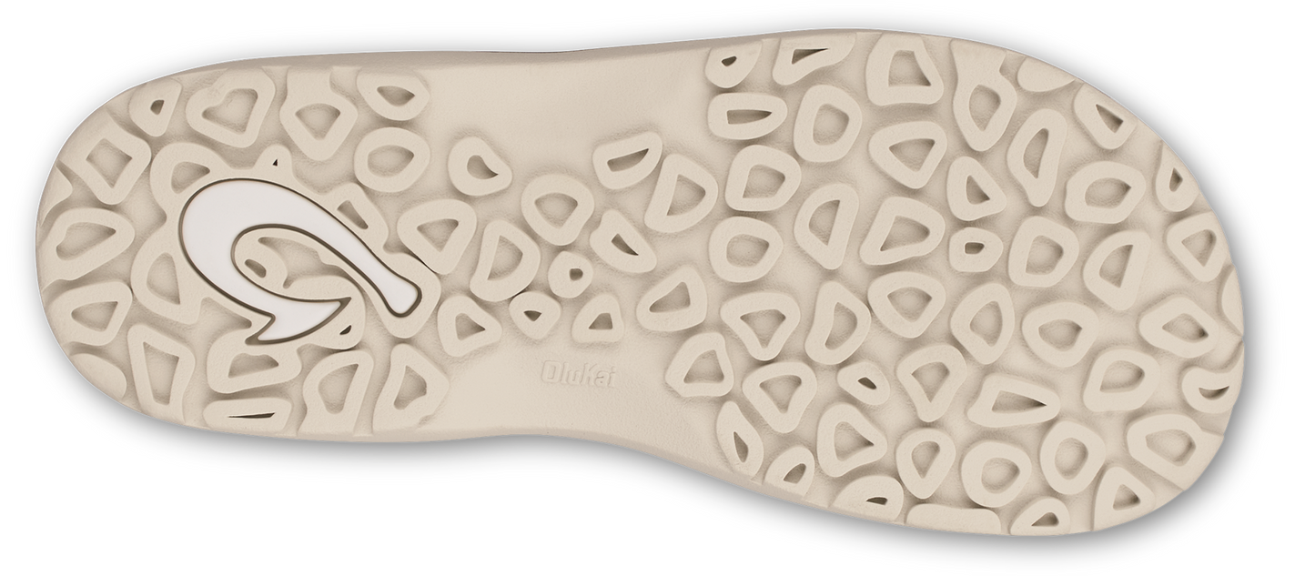 Bottom of a sandal with a repeating pattern of small, rounded shapes and the OluKai logo.