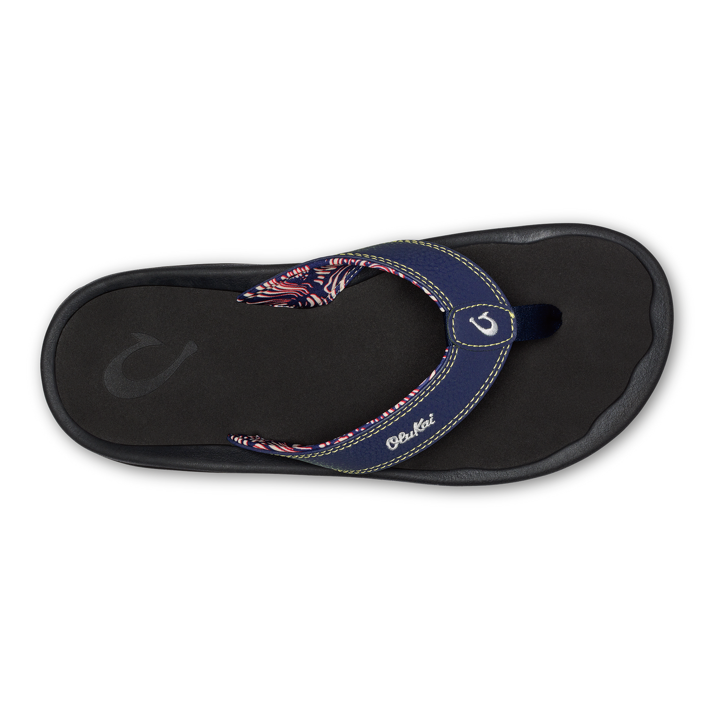 Overhead shot of a dark flip flop with printed strap.