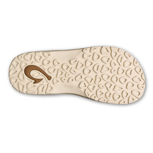 Bottom of sandal with repeating triangular pattern.