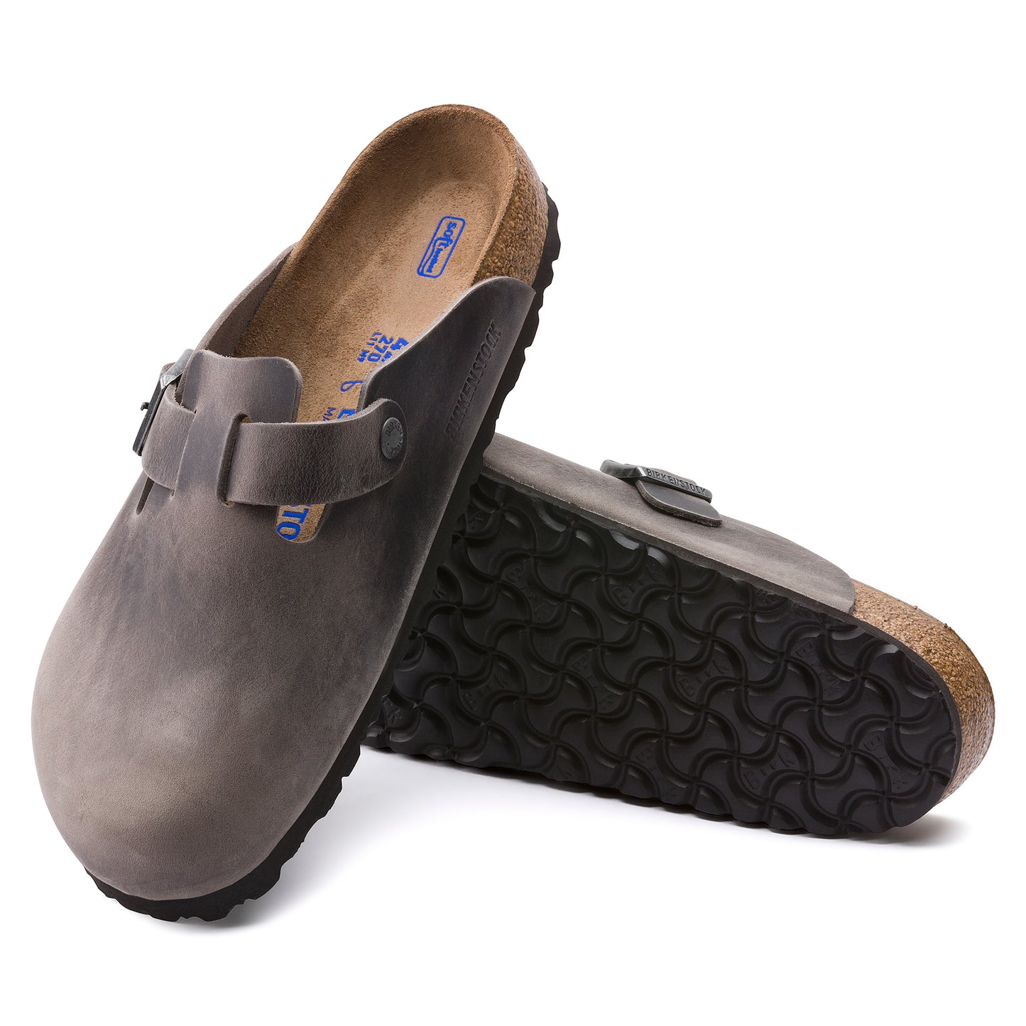 Pair of gray clog shoes with adjustable strap and rubber sole.