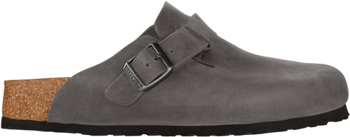 A gray clog with a buckle strap.