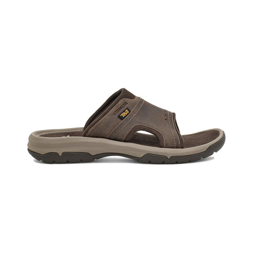 A brown, leather slip-on sandal with a textured sole.